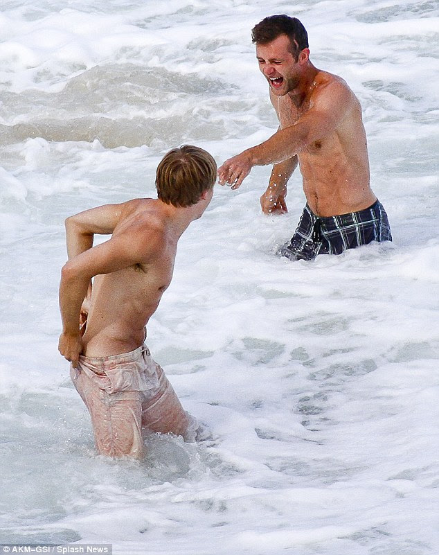Near miss: Tom's shorts nearly falls down - much to Harry's amusement