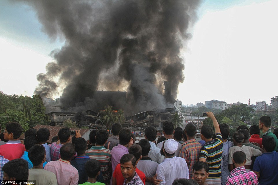 A boiler exploded and triggered a fire at a packaging factory near Bangladesh's capital, killing at least 23 workers and injuring dozens, officials said