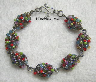 wire wrapped bracelet sead beads coiled with fine stainless steel wire to form beaded beads