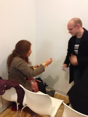 Jane Hirshfield, about to sign a book