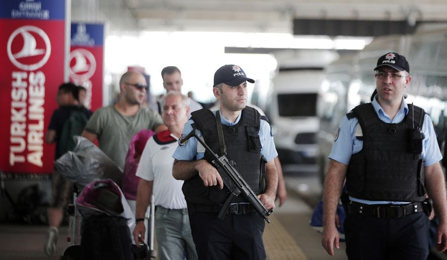 Turkish police officers patrol outside Istanbul&#39;s Ataturk airport, Wednesday, June 29, 2016. Suicide attackers killed dozens and wounded scores of others at Istanbul&#39;s busy Ataturk Airport late Tuesday, the latest in a series of bombings to strike Turkey in recent months. Turkish authorities have banned distribution of images relating to the Ataturk airport attack within Turkey. (AP Photo/Lefteris Pitarakis) 