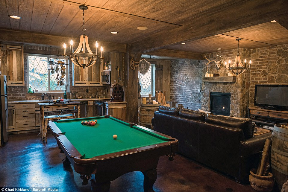 Small touches: As well as the waterfall in the bathroom, and the $8,000-worth of stone used to finish the walls, Mr Kirkham also spent $100 on a medieval helmet and $250 on an Italian crossbow for his basement