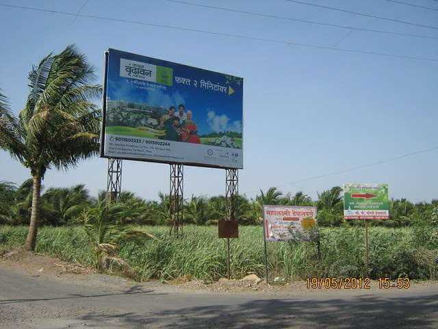 Hoarding of Kanchan Vrundavan at Prayagdham Junction - Visit Kanchan Vrundavan, 1 BHK & 2 BHK Flats at Koregaon Mul, near Uruli Kanchan Pune 412202