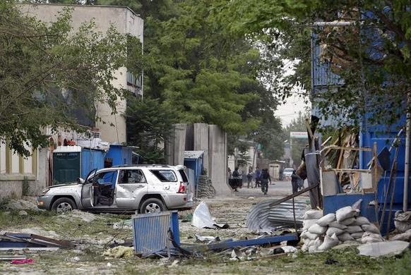 A damaged vehicle is parked at the site of an explosion in Kabul, May 24, 2013. REUTERS-Omar Sobhani