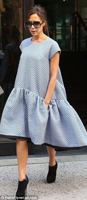 Floaty fashion: Pregnant Chloe Delevinge (L) wore the £1,500 cloud dress designed by Victoria Beckham (R) to sister Poppy's wedding in Knightsbridge on Friday