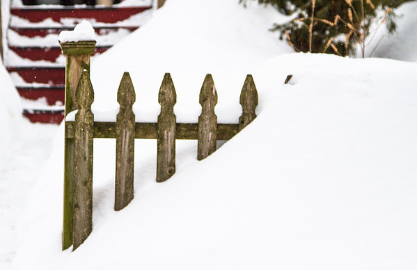 snow against a fence