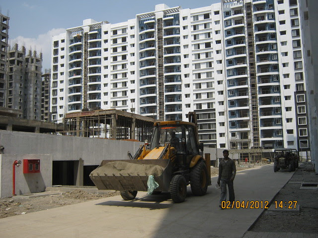 Sparklet - Megapolis Smart Homes 1, Hinjewadi Phase 3, Pune 411057 - Internal cement concrete road & under construction club house on the podium