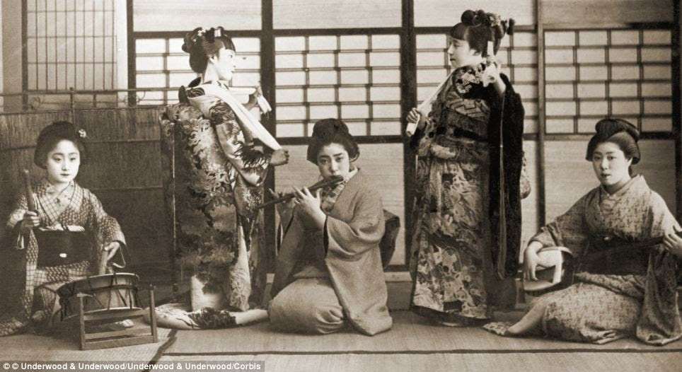 Japanese geisha dancing and playing music in 1901