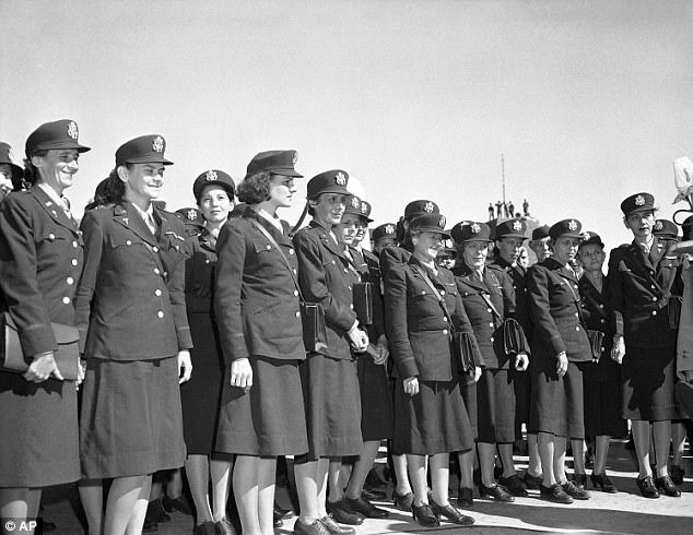 Army nurses who were captives of the Japanese after the fall of Bataan and Corregidor line up at Hamilton Field, California shortly after arriving in the United State