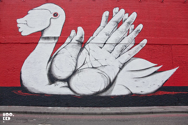 Italian street artist Run paints a new mural on East London's iconic Village Underground Wall. Italian street artist Run paints a new mural on East London's iconic Village Underground Wall.