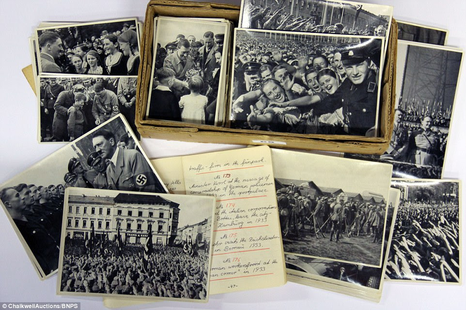 The controversial collection of photos and notebook, most probably compiled by an English-speaking fan of the Nazi dictator, are being sold by Chalkwell Auctions, based in Southend-on-sea, Essex. The pictures, which have an estimate of £150, will be sold on Wednesday