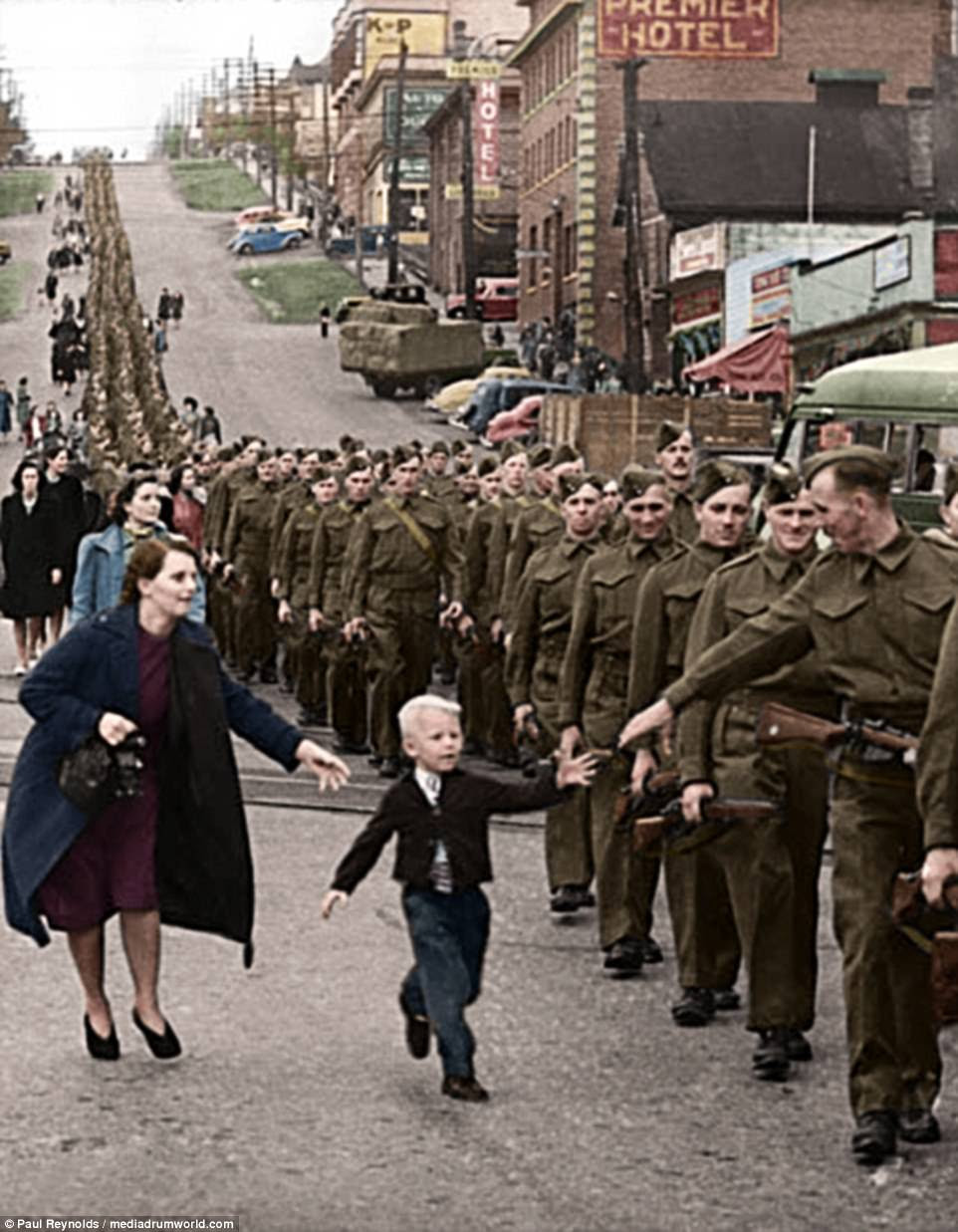 Warren Bernard, five, chases after his father Private Jack Bernard in New Westminster, British Columbia in 1940. The photo was taken before the US joined the war, as Canadian soldiers headed for England. Private Bernard returned home in 1945