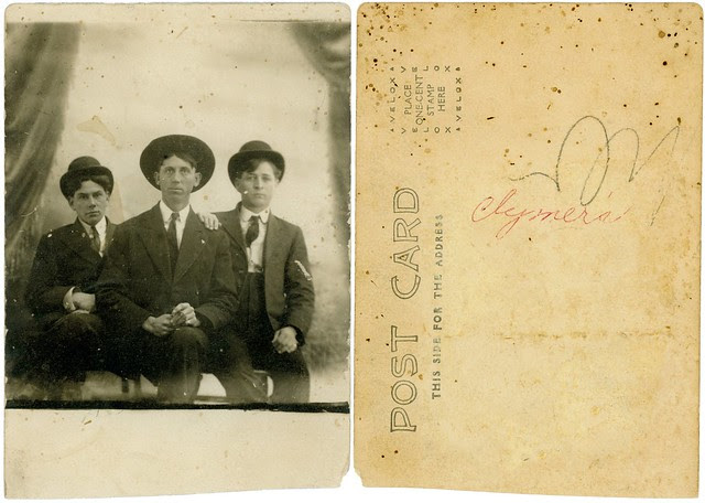 Three guys in hats with reverse