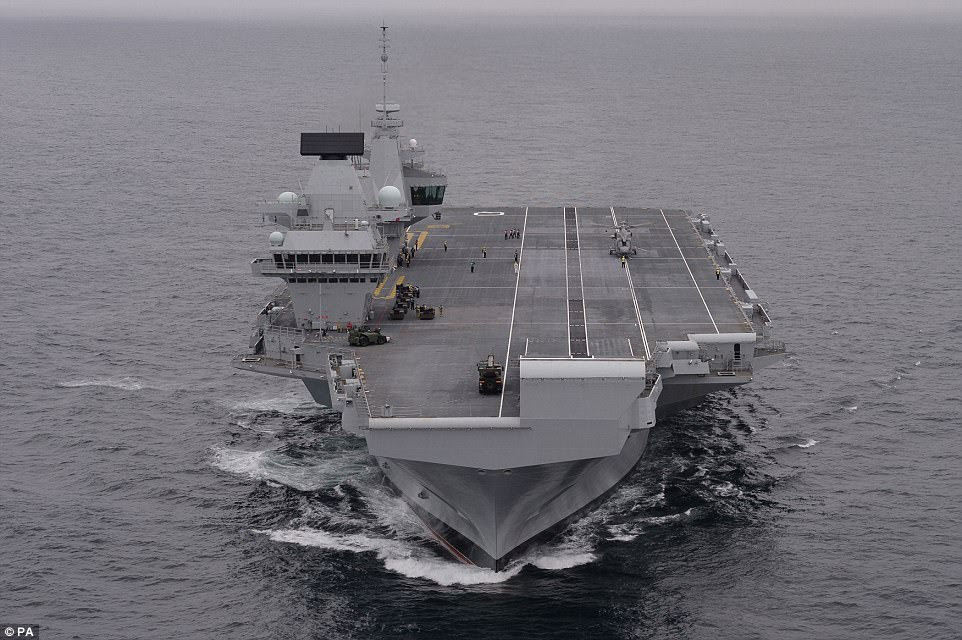 The training will better equip UK personnel who will man the new HMS Queen Elizabeth, above, the Royal Navy's aircraft carrier