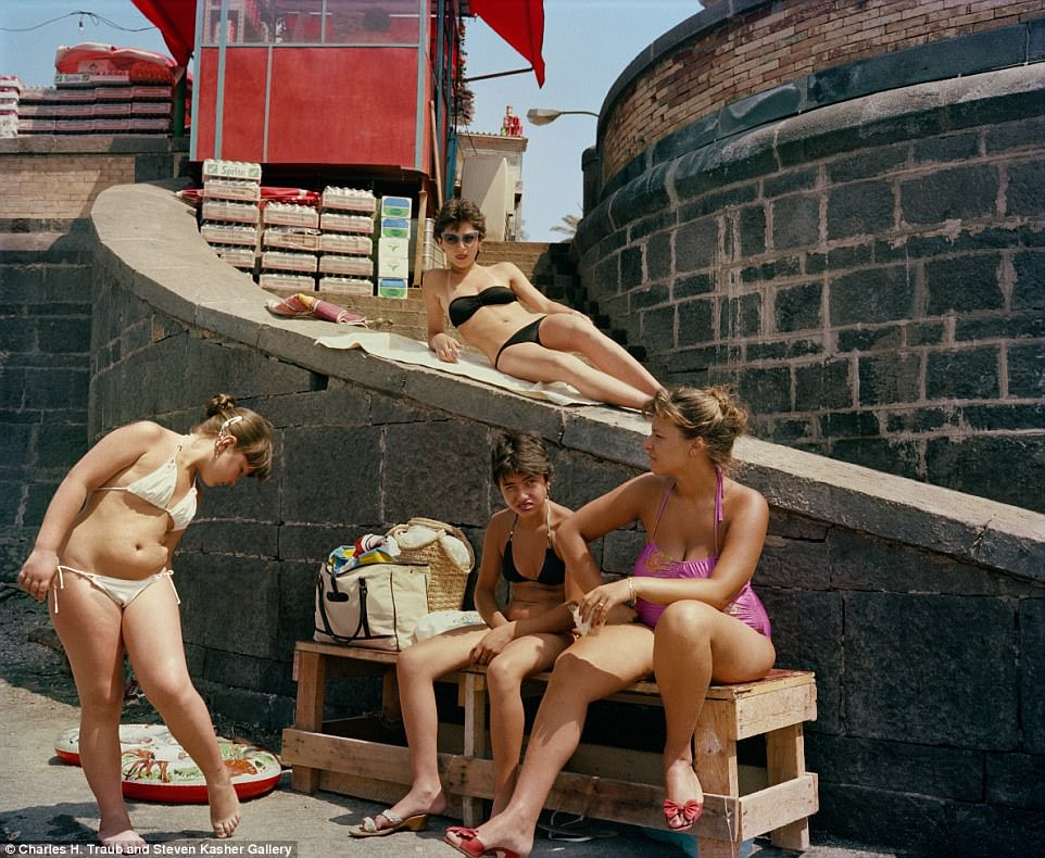 Life's a beach: Four women soak up the sun in their swimsuits in Naples in 1982