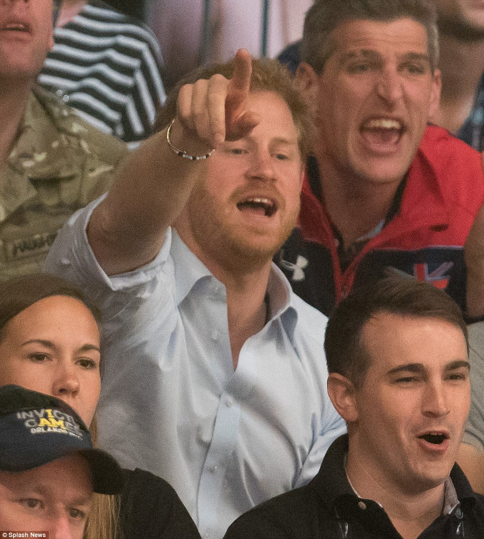 The prince, wearing a pale shirt and two bracelets, one beaded and one seemingly copper, shouted on his team during the match
