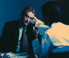Photograph of a man talking to his doctor