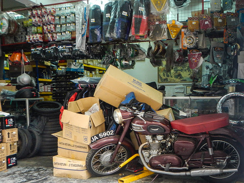 Motorcycle Repair Shop with Old Triumph