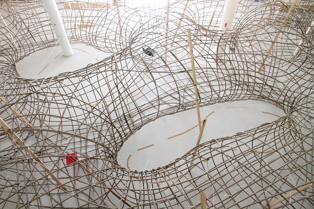 Artist Henrique Oliveira Constructs a Cavernous Network of Repurposed Wood Tunnels at MAC USP Artist Henrique Oliveira Constructs a Cavernous Network of Repurposed Wood Tunnels at MAC USP wood installation architecture