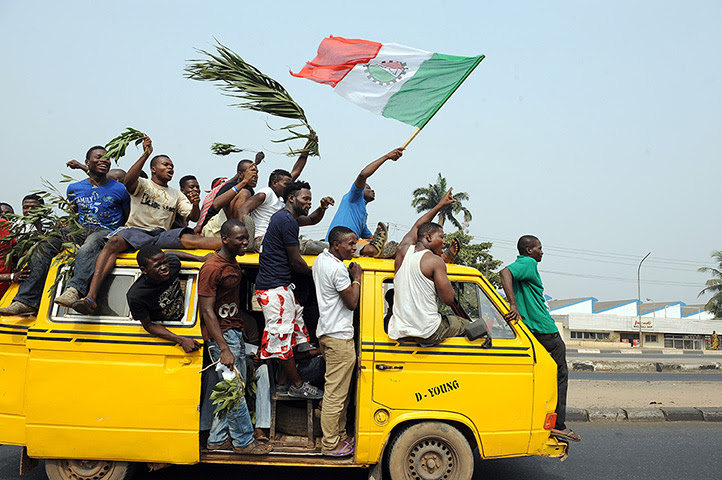 Nigeria fuel protests: A minibus carries protestors through Lagos  