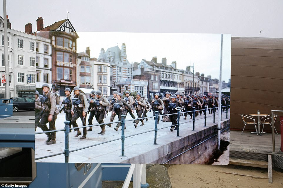 Weymouth, England. 1944:  US troops on the Esplanade at Weymouth, Dorset, on their way to embark on ships bound for Omaha Beach for the D-Day landings. 2014: A view of the seafront littered with cafes