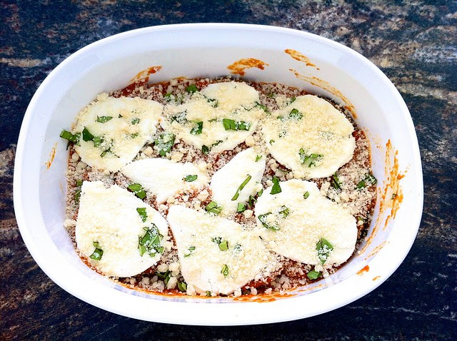 Marinara, Mozzarella, Basil and Parmesan Covering 1st Layer of Eggplant