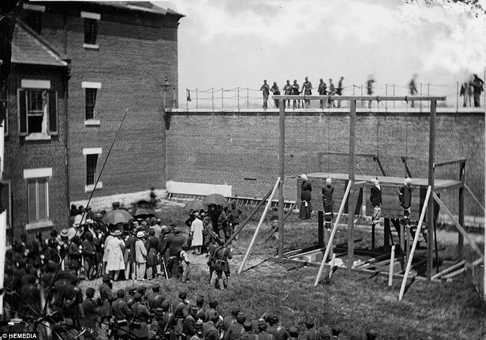 At the Gallows: Lincoln conspirators hang. Mary Surratt (hanging, far left) and three of the other convicted conspirators in the assassination of President Abraham Lincoln on July 7 1865. Her last words were, 'Please don't let me fall'.