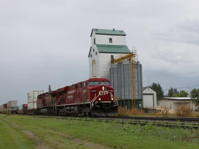 CP 8883 and grain elevator at Austin MB