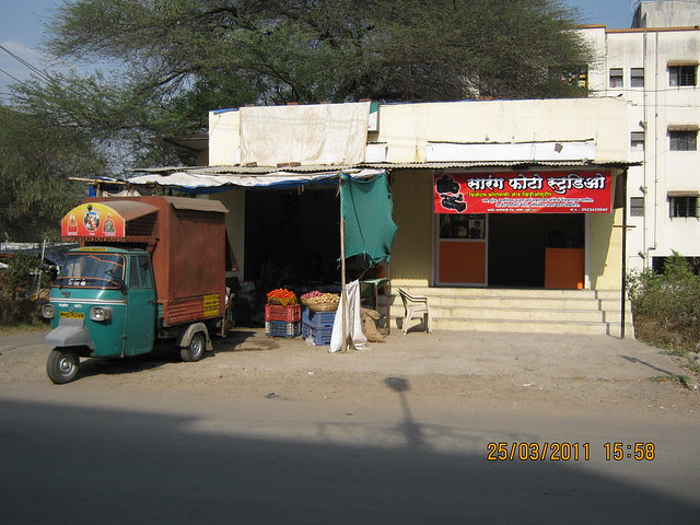 Vegetable shop and Sarang Photo Studio at the entrance of the lane to Prathamesh Park, off Balewadi Phata, Baner Pune