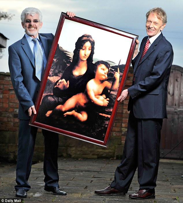 Reunited: The pair hold a replica at the painting. They agreed to act as a go between in order to get the painting back from a criminal on <span class=