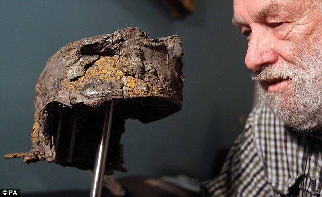 Precious find: Ken Wallace with the cavalry helmet he unearthed during its unveiling at the British Museum