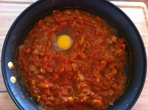 Egg Cracked into Tomato Sauce