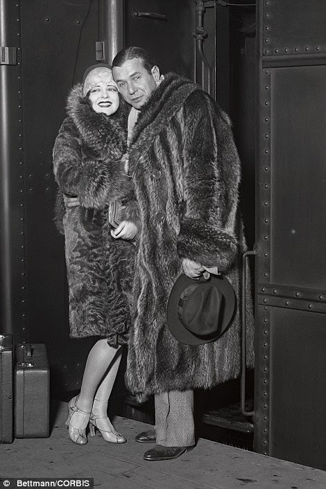 Hollywood stars Clara Bow, pictured left with singer Harry Richman, and Jean Harlow, pictured right, are shown arriving at Grand Central Station in the 1930s