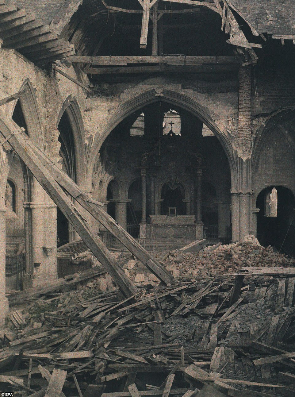 Trail of destruction: This image, taken in 1917, shows debris inside a 'ruined church'. It is believed to have been located in France