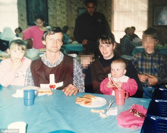 Claire Ashman pictured with her ex-husband and children around a table at William Kamm's religious doomsday cult before she escaped