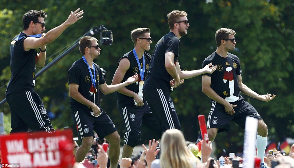 Boy band material? (from left) Hummels, Lahm, Durm, Kramer and Muller all get in on the guitar act
