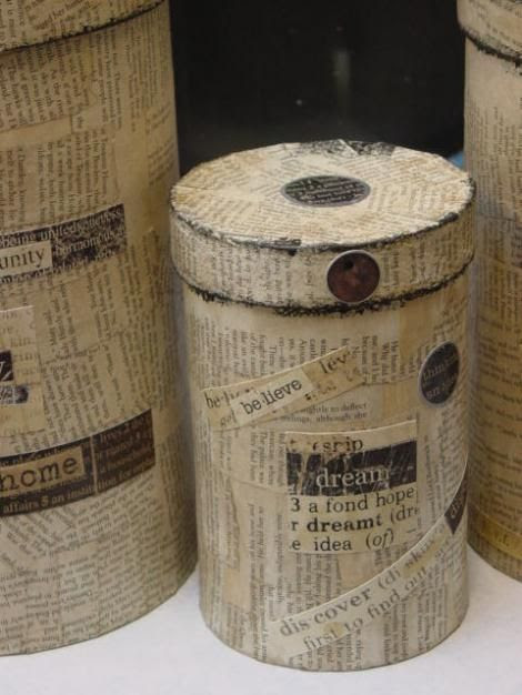 finished oatmeal boxes covered with book pages