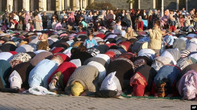 In this 2008 file photo, Albanian Muslims pray to mark the end of the fasting month of Ramadan. Turkey is planning to build a mosque for Albanians in Tirana.