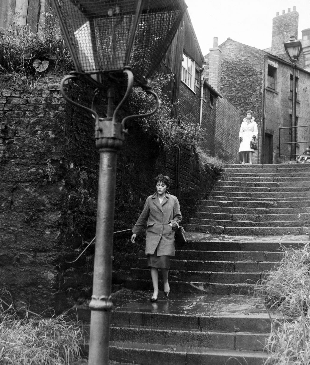 Scenes from the British film Payroll. A crime thriller starring Michael Craig and Franoise Prvost. Directed by Sidney Hayers. Billie Whitelaw trailing Francois Prevost, on the Long Stairs, Newcastle. Circa 1961