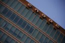 A logo of China National Offshore Oil Corp (CNOOC) is seen at the top of its headquarters in Beijing