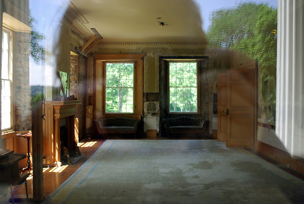 A shot through the window into the main parlor area of the mansion.