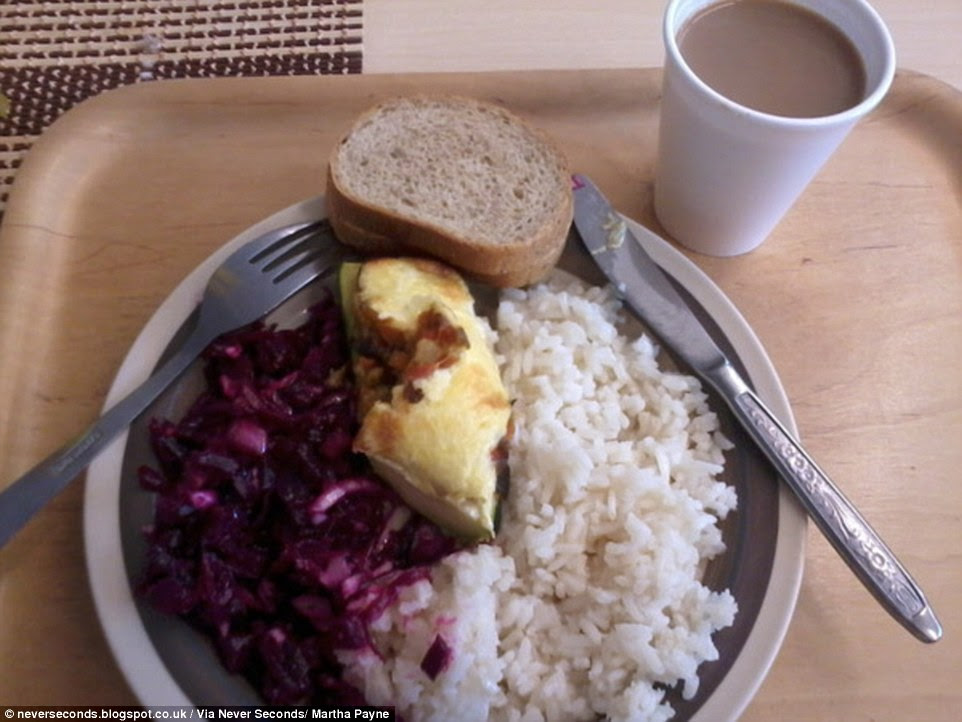 Lunch in an Estonian school is rice with a piece of meat and purple cabbage. They also have bread and a get a cup of chocolate drink 