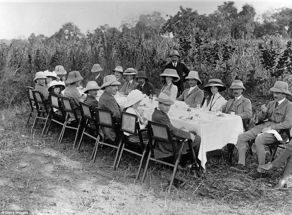Pictured: An outdoor hunting supper held during King George V's tour of India which saw animals baited with cattle tied up in the jungle