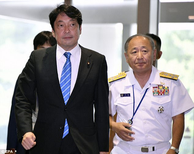 Joint Staff Chief of Staff Katsutoshi Kawano (R), Japanese Defense Minister Itsunori Onodera (L) arrives at the Defense Ministry headquarters in Tokyo