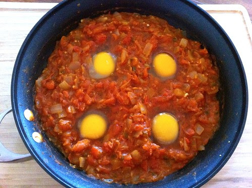 4 Eggs Cracked into Tomato Sauce
