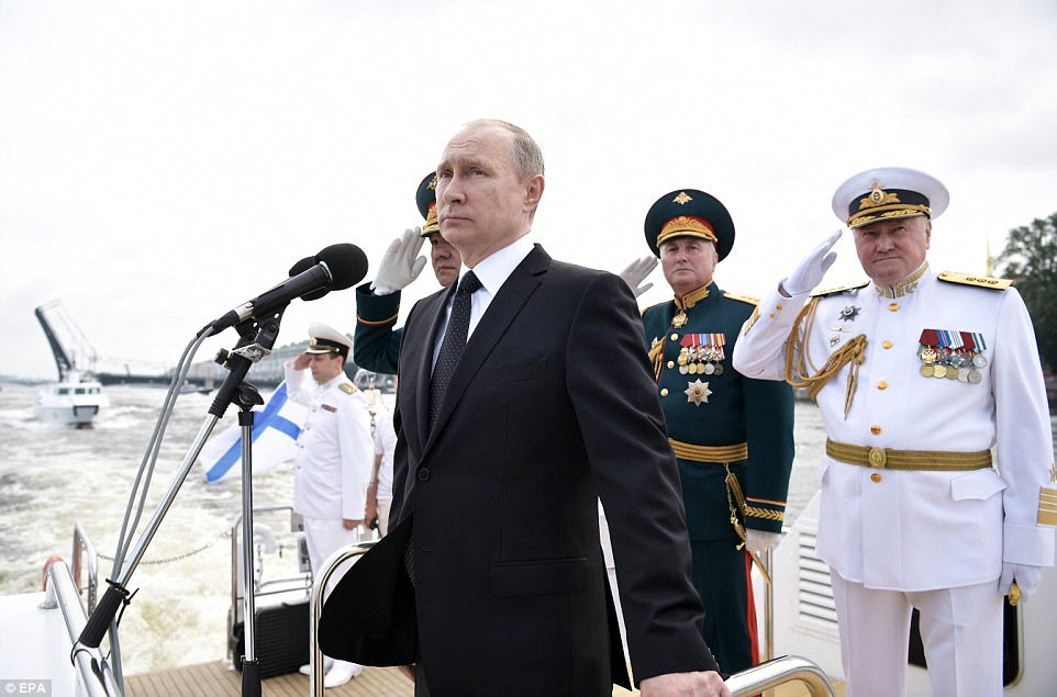 Russian President Vladimir Putin oversaw a pomp-filled display of Russia's naval might as the Kremlin paraded its sea power from the Baltic Sea to the shores of Syria