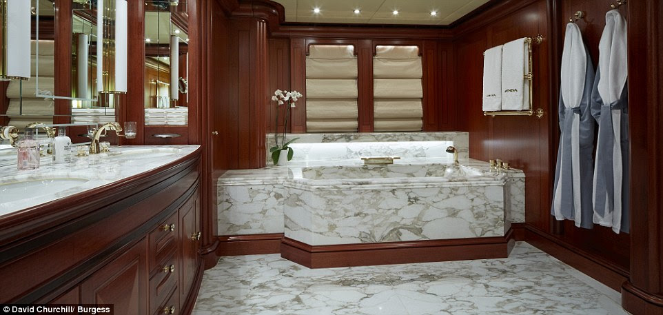 The master suite  boasts a a large marble Jacuzzi tub in the spacious bathroom which also has his'n'hers sinks