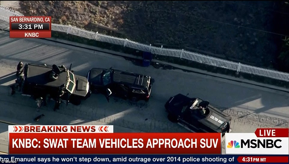 Armed police, armored vehicles and dozens of cop cars have now surrounded the vehicle where one gunman has been shot dead, while police are believed to be looking for up to two others