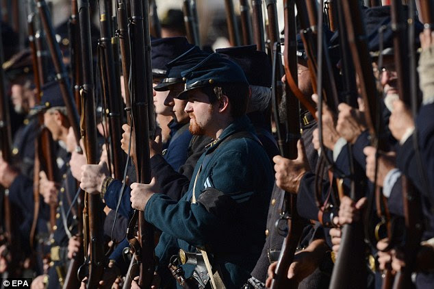 At the ready: Re-enactors portraying Union troops prepare for battle 
