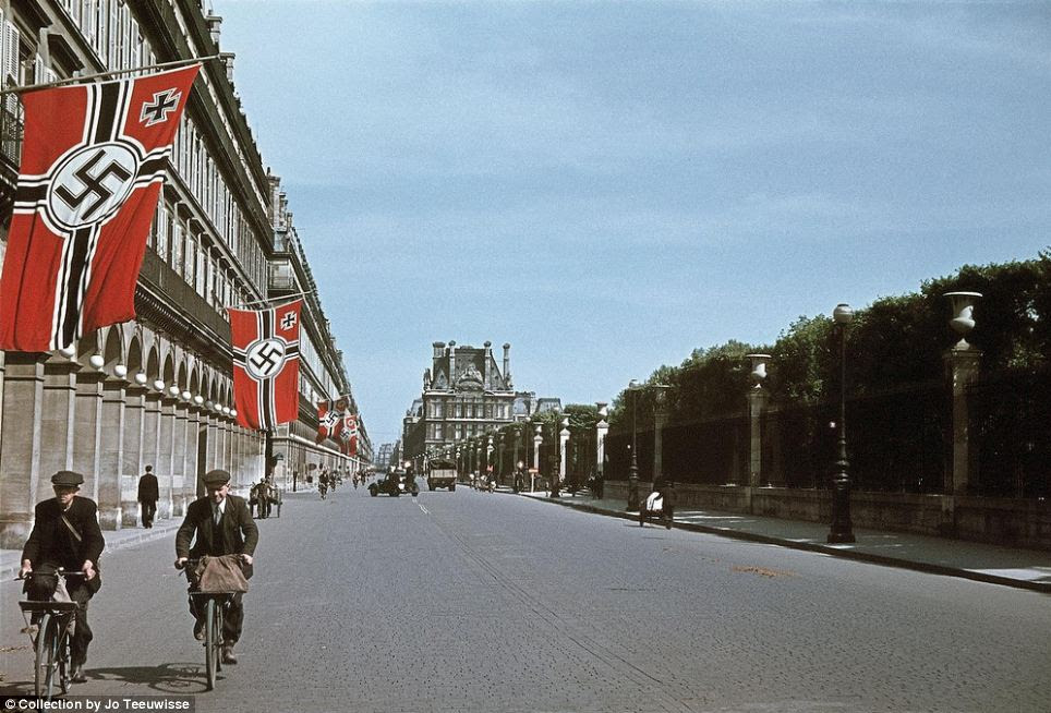 Nazi occupied Paris: Giant Swastikas line the streets of the French capital. Paris fell to the Germans just weeks after the Nazis launched an invasion in 1940